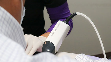 Dr. Sjogren using CEREC intraoral camera technology